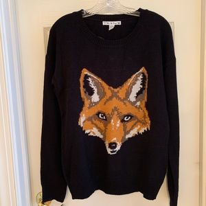 Black sweater with fox head pattern
